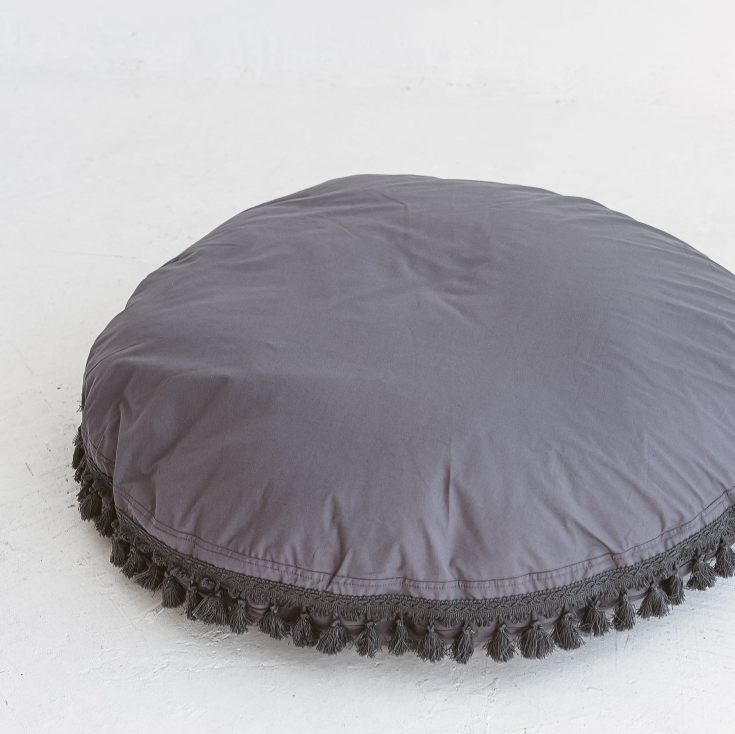 MINICAMP Large Floor Cushion With Tassels in Grey - Edie And I
